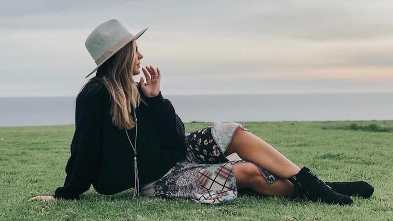 Hannah B sitting on grass