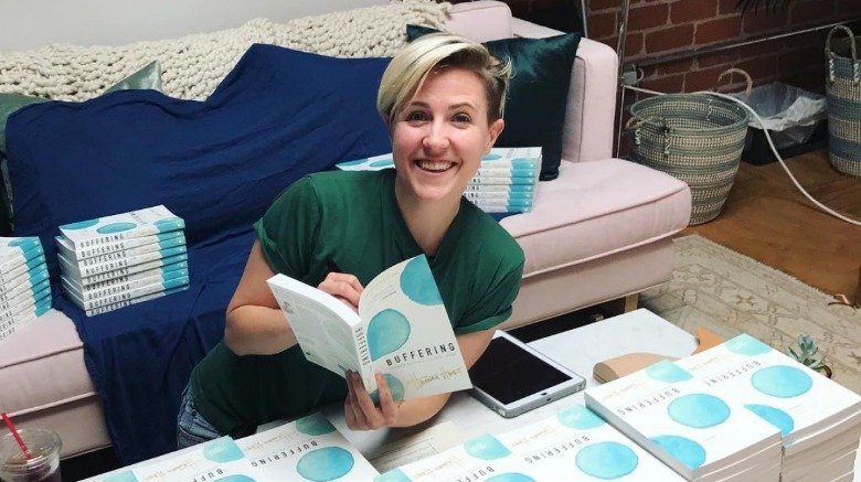 Hannah Hart with books