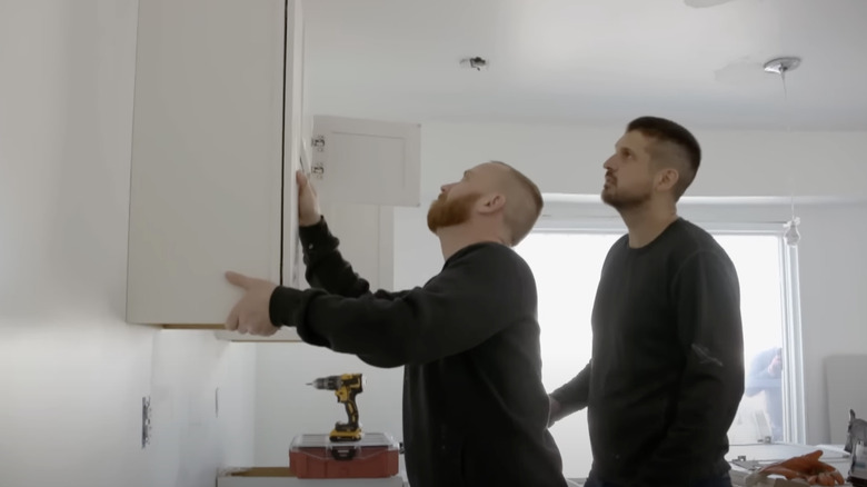 Keith Bynum & Evan Thomas installing cabinetry