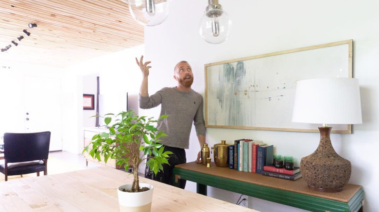 Keith Bynum posing in remodeled home