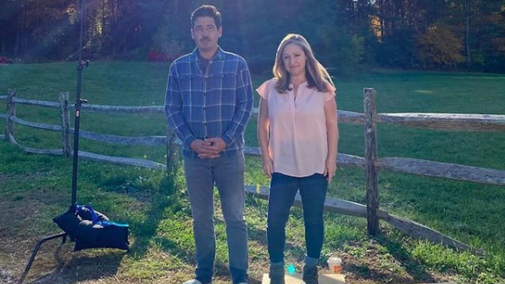 Jonathan Knight and Kristina Crestin standing outside