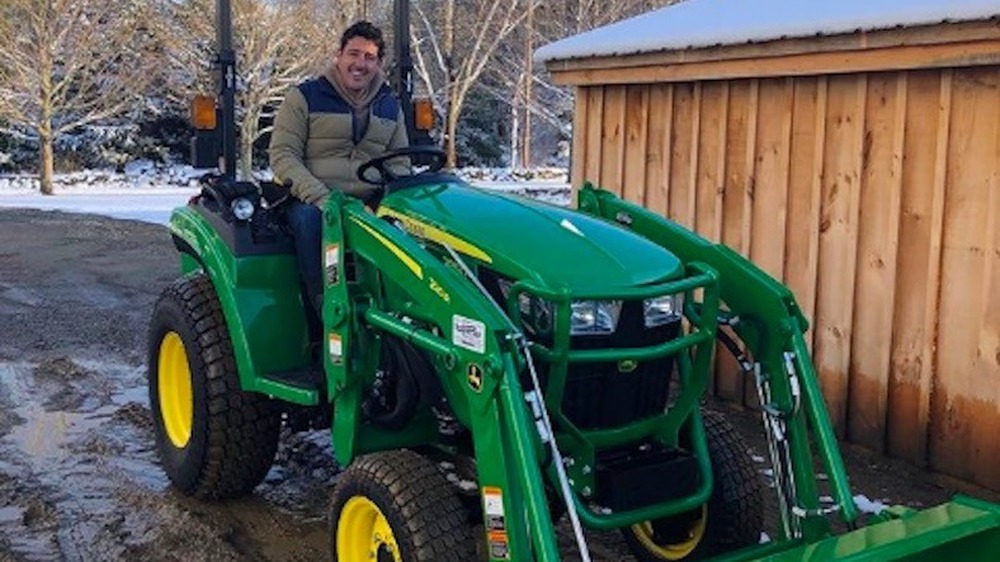 Jonathan Knight on a tractor