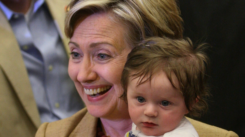 Hillary Clinton with a baby