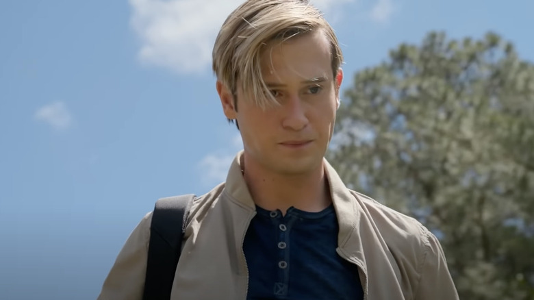 Tyler Henry walking while filming his new series "Life After Death"