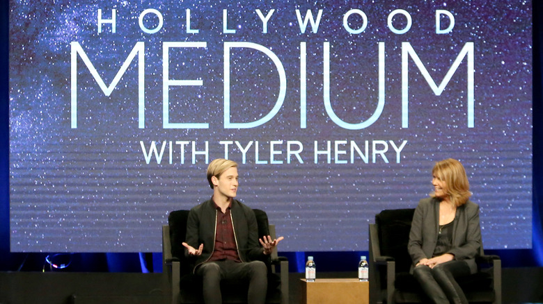 Tyler Henry on stage talking about his show "Hollywood Medium."