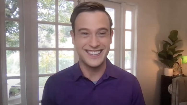 Tyler Henry has a big smile while discussing his book