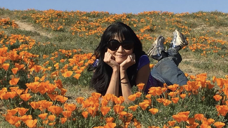 House Hunters host Suzanne Whang in a poppy field