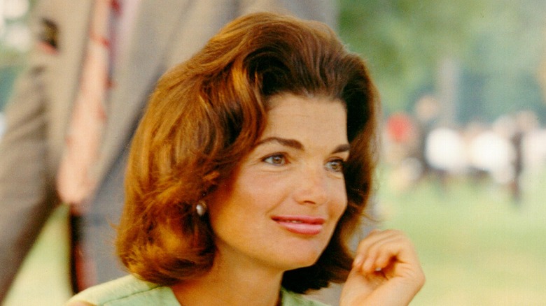 Jackie Kennedy Onassis wearing green, up-close 