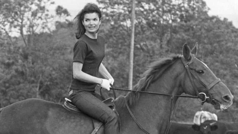 Jackie Kennedy Onassis riding a horse