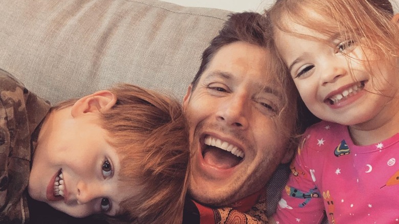 Jensen Ackles smiling with his twins 