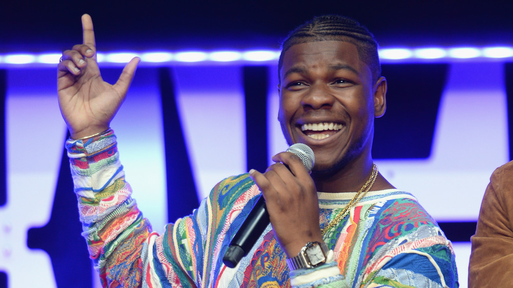 John Boyega pointing and laughing