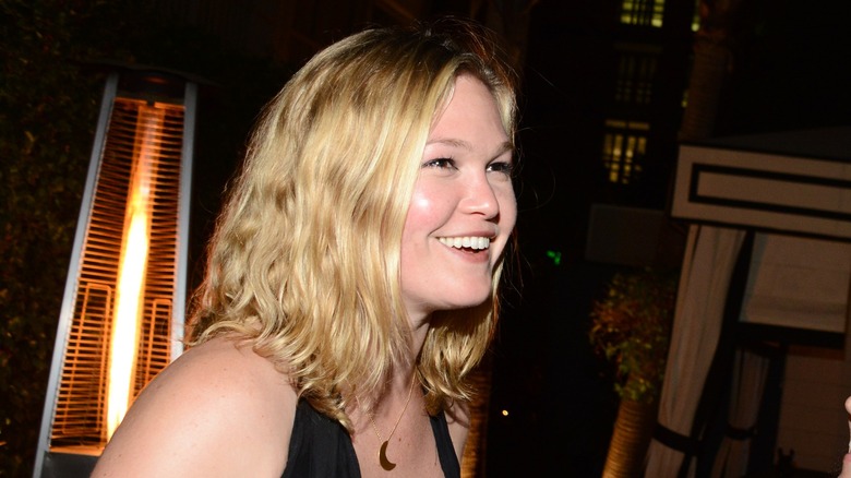 Julia Stiles laughing to side