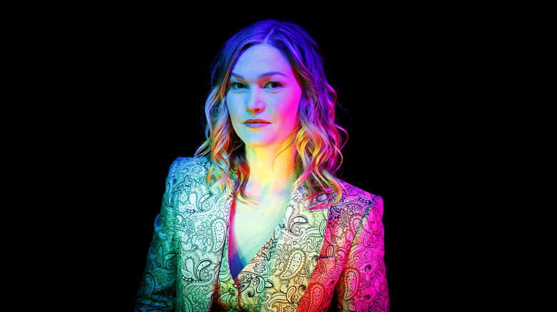 Julia Stiles black background staring