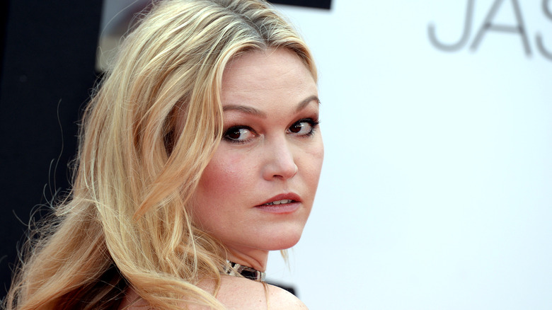 Julia Stiles smiling on the red carpet