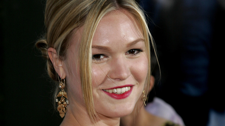 Julia Stiles smiling with her hair up