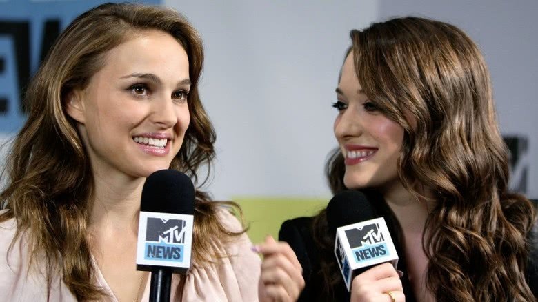 Natalie Portman and Kat Dennings talking into microphones