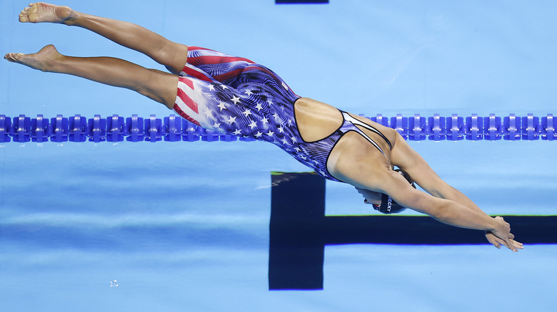 Katie Ledecky diving into the water