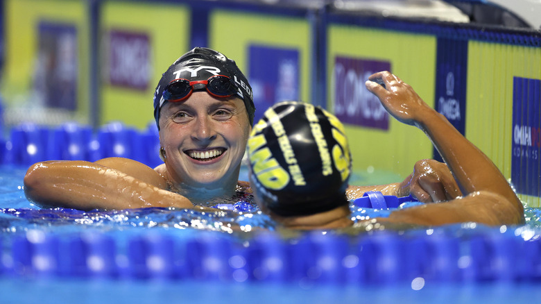 Katie Ledecky embracing another swimmer