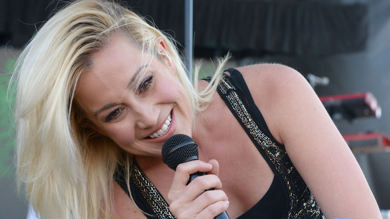 Kellie Pickler smiling while performing