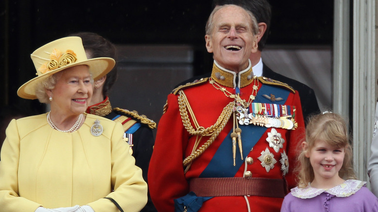 Lady Louise and her grandparents on balcony