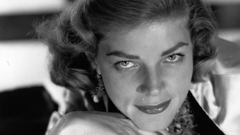 Lauren Bacall smiling seductively