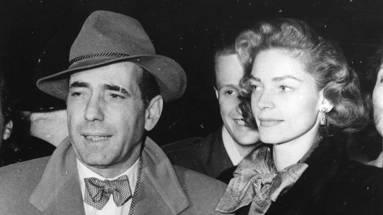 Humphrey Bogart walking with Lauren Bacall