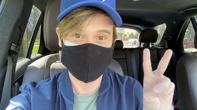 Tyler Henry wearing a mask