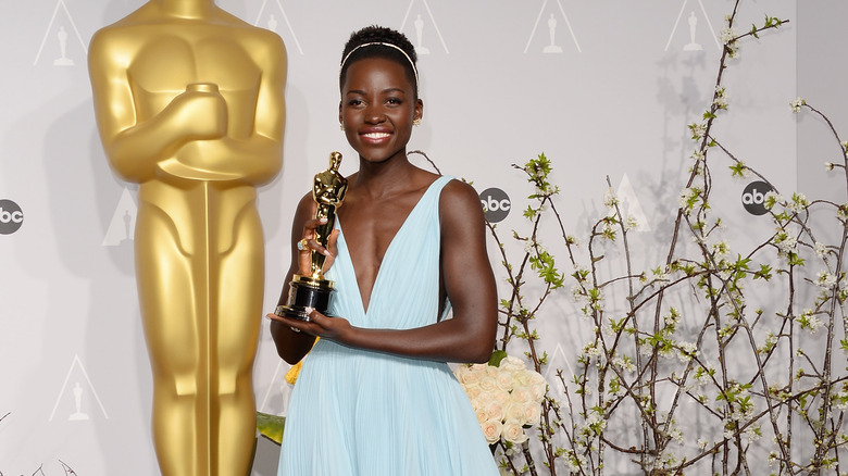 Lupita Nyong'o with her Oscar trophy