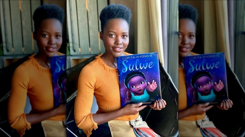 Lupita Nyong'o with her book