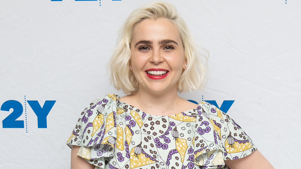 Mae Whitman smiling with blonde hair