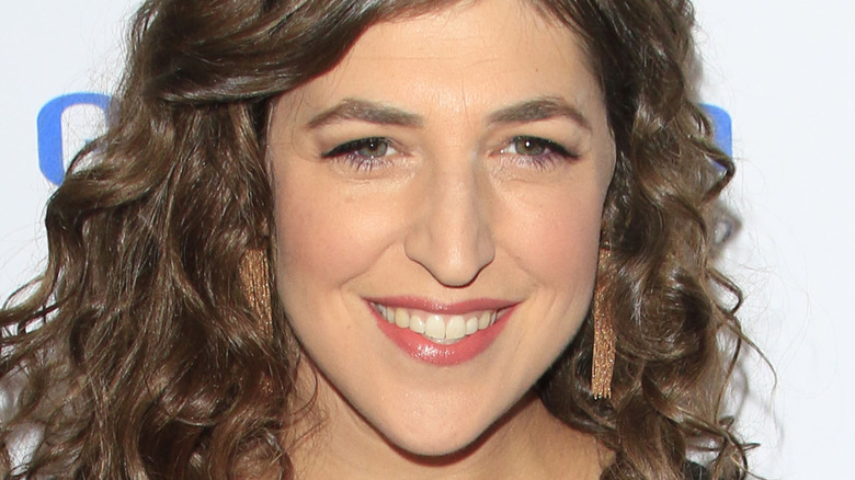 Mayim Bialik with curly hair, smiling