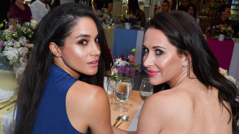 Meghan Markle and Jessica Mulroney looking back