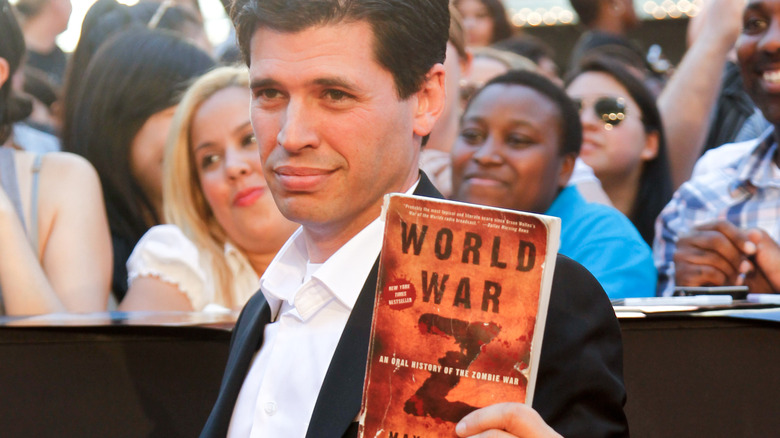 Max Brooks holding his book World War Z