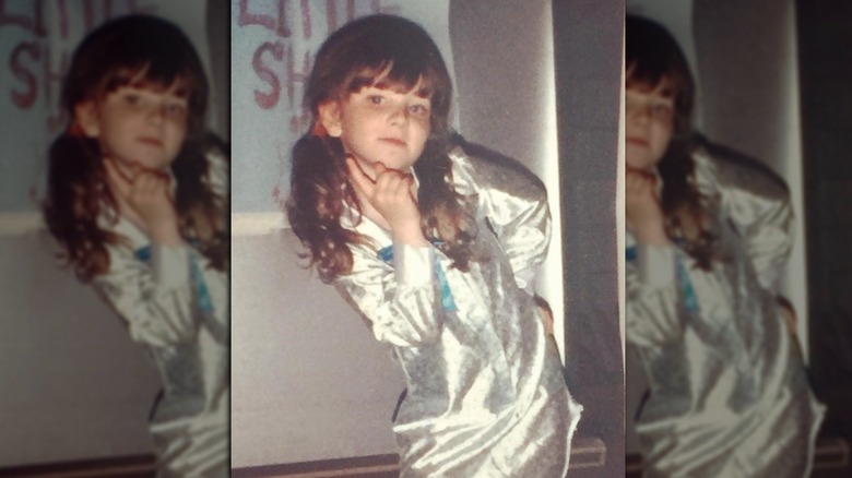 Melissa Rauch posing as a child