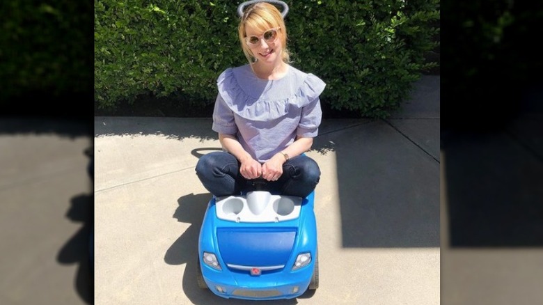 Melissa Rauch in a tiny car