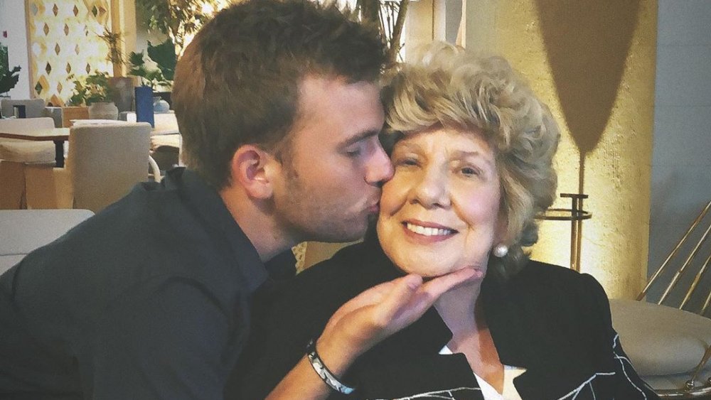 Chase Chrisley kissing Nanny Faye Chrisley on the cheek