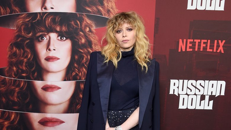 Natasha Lyonne in front of a Russian Doll poster