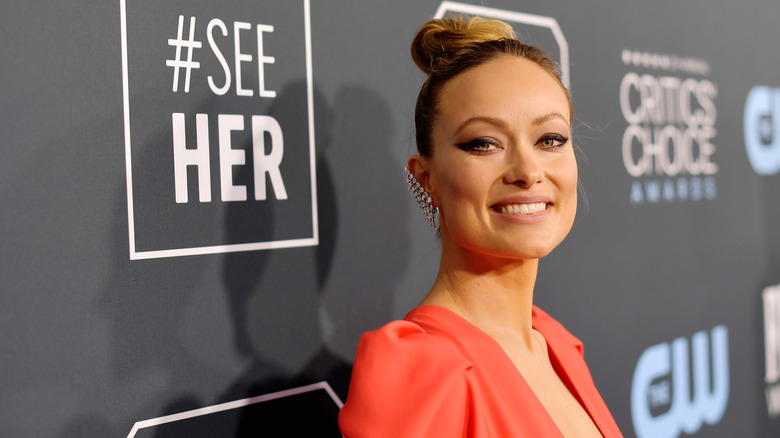 Olivia Wilde smiling on the red carpet