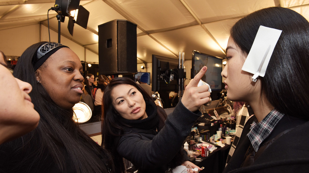 Pat McGrath assessing a model