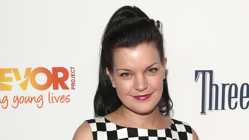 Pauley Perrette in a black and white dress