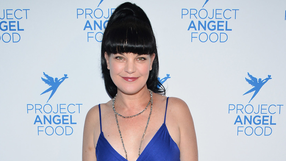 Pauley Perrette in a blue dress