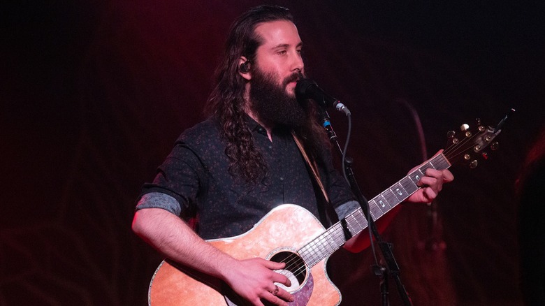 Avi Kaplan with a guitar