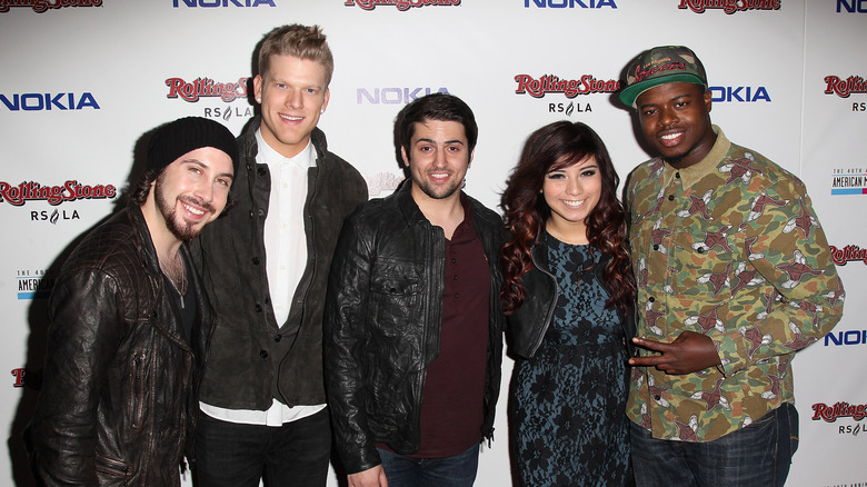 Pentatonix posing on the red carpet