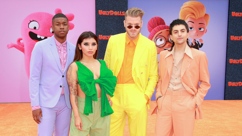 Pentatonix posing on the red carpet