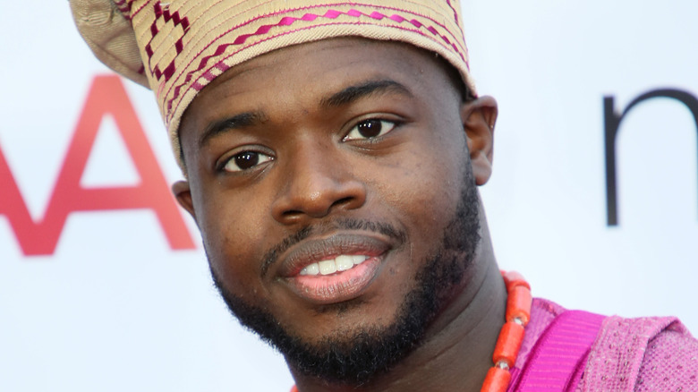 Kevin Olusola attending an event