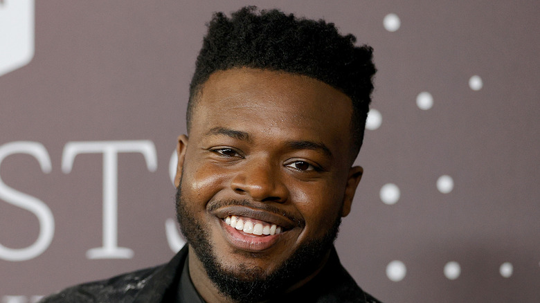 Kevin Olusola attending an event