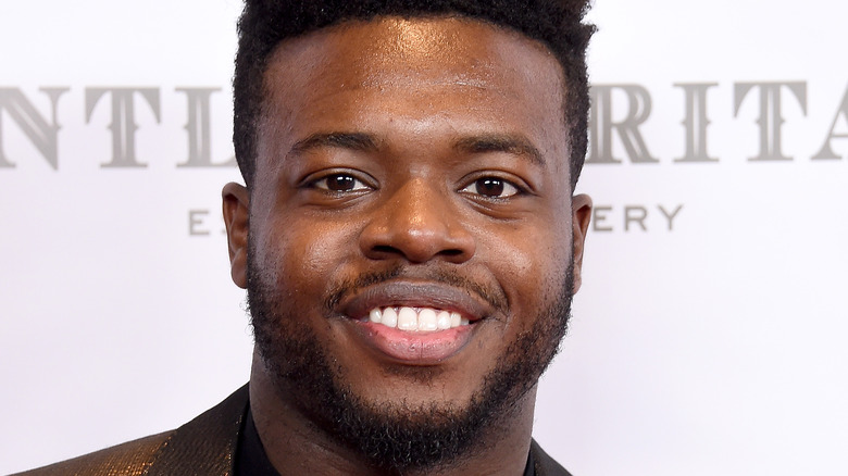 Kevin Olusola attending an event