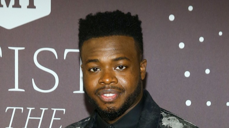 Kevin Olusola attending an event