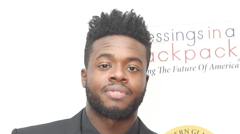 Kevin Olusola attending an event