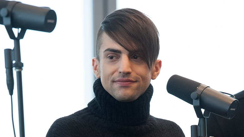 Mitch Grassi at a microphone